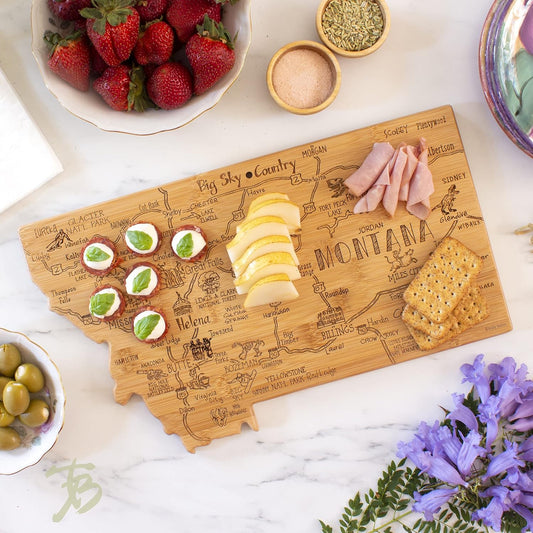 Destination Montana State Shaped Cutting Board | State charcuterie serving board with engraved map artwork. Smooth reverse side for food prep. Hang tie for wall display.