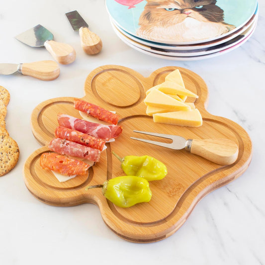 Dog Paw Shaped Cutting and Charcuterie Board, 11 x 10 in | Bamboo paw-shaped serving board with juice grooves for prep and entertaining. Built-in keyhole for easy wall display.