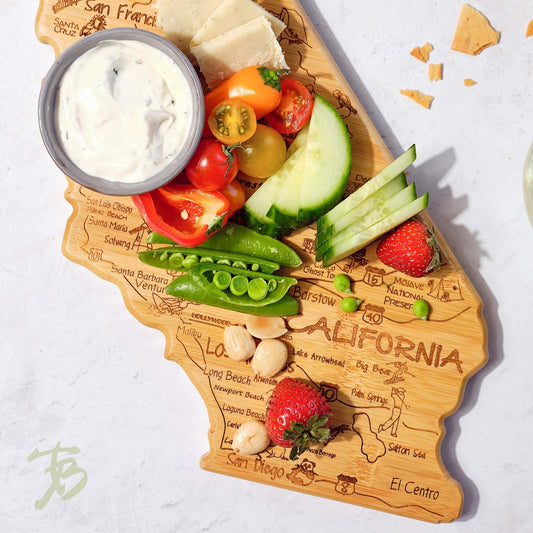 Destination California State Shaped Cutting Board | State charcuterie serving board with engraved map artwork. Smooth reverse side for food prep. Hang tie for wall display.