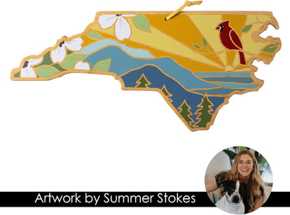 North Carolina State Shaped Cutting Board, Summer Stokes Art | State charcuterie board with colorful hand-drawn landscape art. Smooth reverse side for food prep. Hang tie for wall display. - Colors A