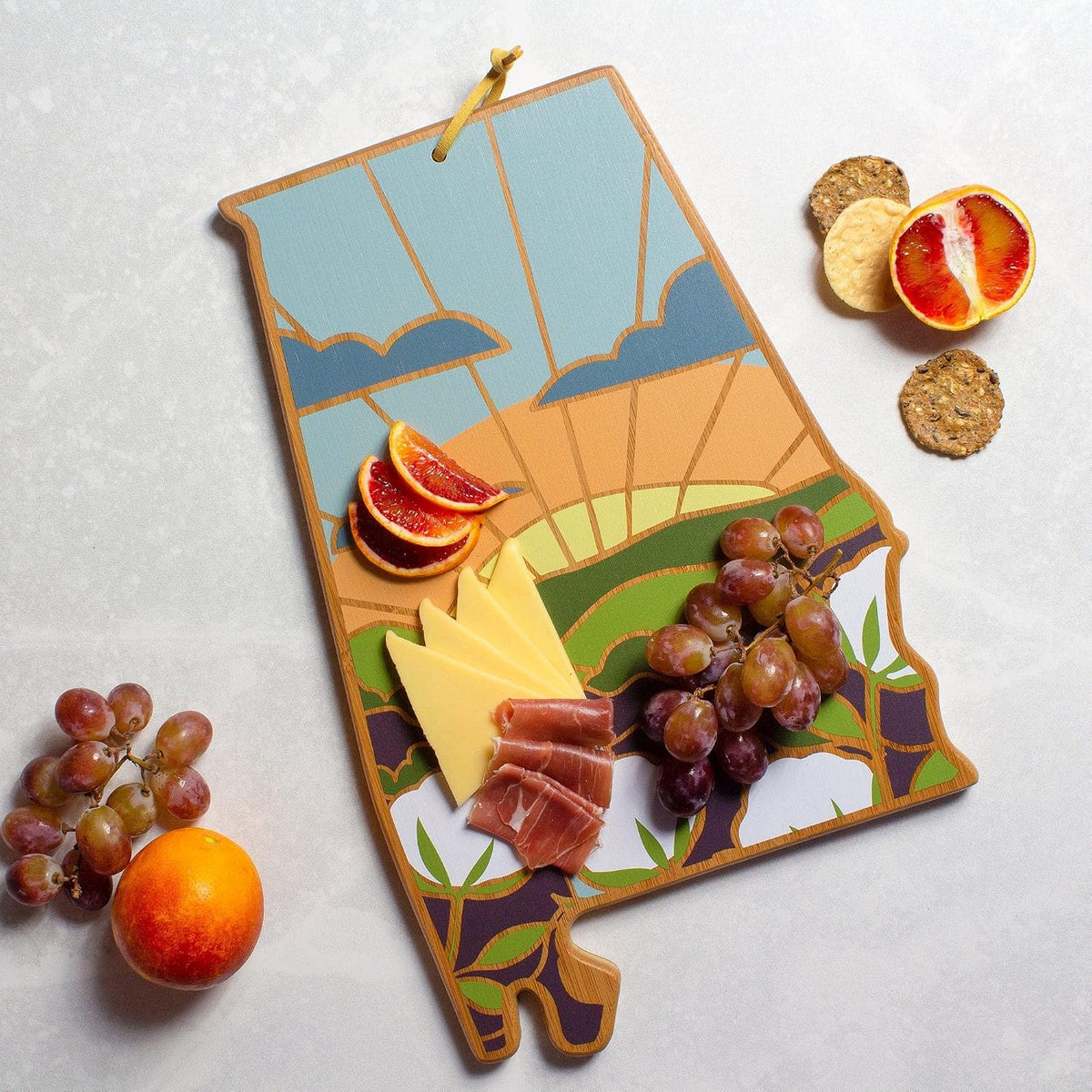 North Carolina State Shaped Cutting Board, Summer Stokes Art | State charcuterie board with colorful hand-drawn landscape art. Smooth reverse side for food prep. Hang tie for wall display. - Colors A