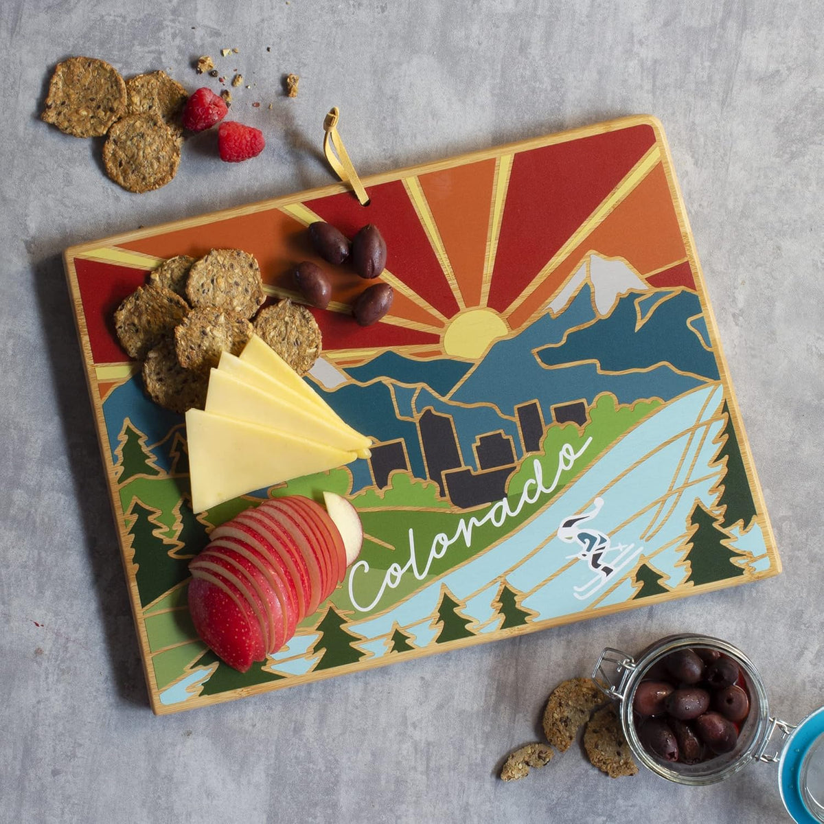 North Carolina State Shaped Cutting Board, Summer Stokes Art | State charcuterie board with colorful hand-drawn landscape art. Smooth reverse side for food prep. Hang tie for wall display. - Colors A