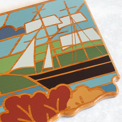 North Carolina State Shaped Cutting Board, Summer Stokes Art | State charcuterie board with colorful hand-drawn landscape art. Smooth reverse side for food prep. Hang tie for wall display. - Colors A