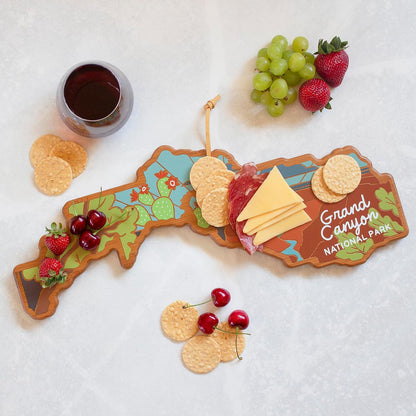 North Carolina State Shaped Cutting Board, Summer Stokes Art | State charcuterie board with colorful hand-drawn landscape art. Smooth reverse side for food prep. Hang tie for wall display. - Colors A