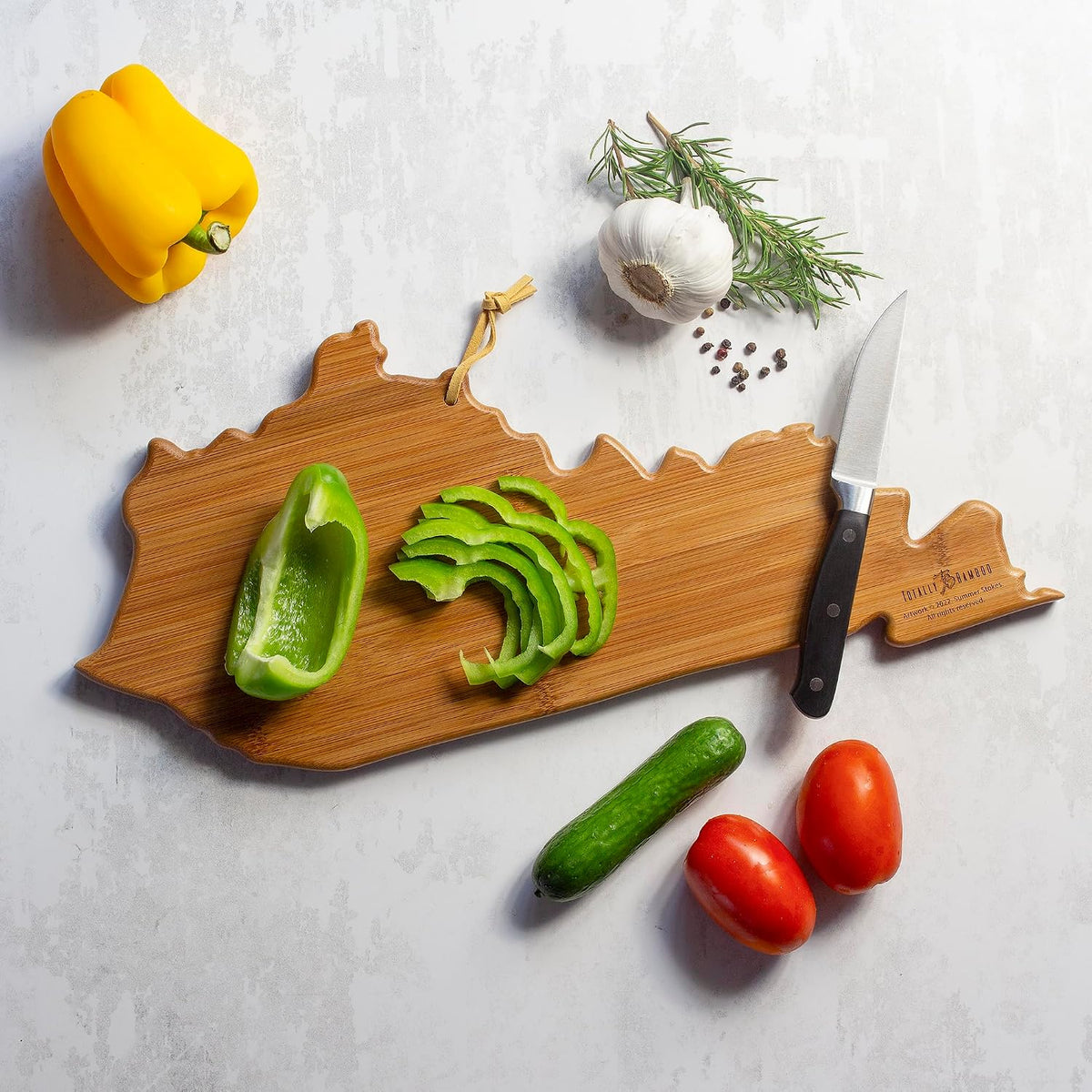 North Carolina State Shaped Cutting Board, Summer Stokes Art | State charcuterie board with colorful hand-drawn landscape art. Smooth reverse side for food prep. Hang tie for wall display. - Colors A