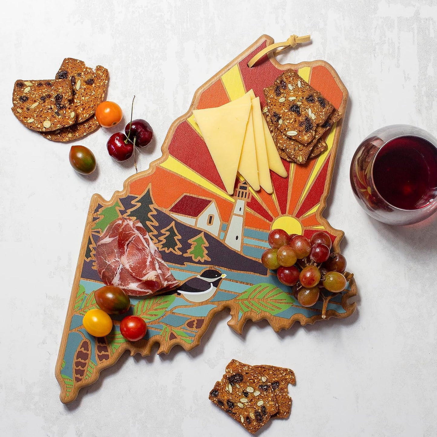 North Carolina State Shaped Cutting Board, Summer Stokes Art | State charcuterie board with colorful hand-drawn landscape art. Smooth reverse side for food prep. Hang tie for wall display. - Colors A