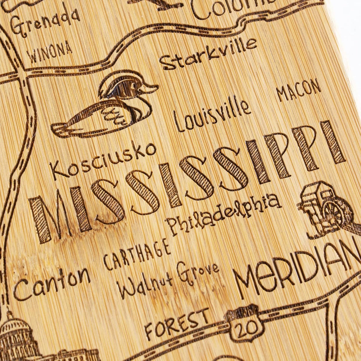 Destination Mississippi State Shaped Cutting Board | State charcuterie serving board with engraved map artwork. Smooth reverse side for food prep. Hang tie for wall display.