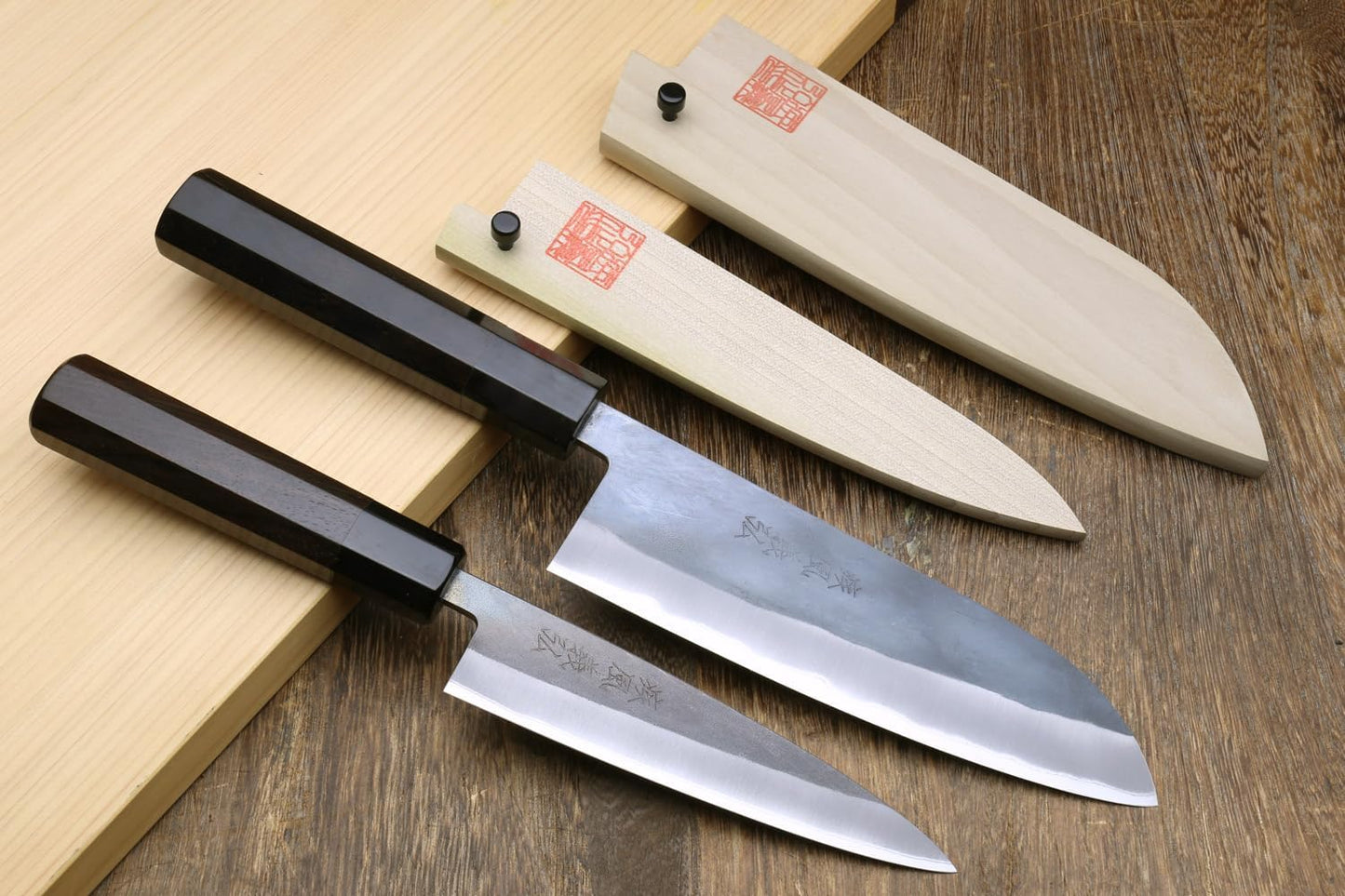 Yoshihiro Kurouchi Black-Forged Blue Steel Stainless Clad Santoku Chefs Knife and Petty Utility Knife 2pc Set Ebony Handle (Santoku 165mm / Petty 135mm & Saya Cover)