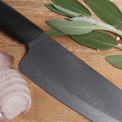 Kyocera Advanced Ceramic Revolution Series 6-inch Nakiri Vegetable Cleaver, Black Handle, White Blade