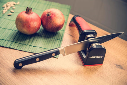Arcos Sharpeners Manual Knife Sharpener tool. Made of ABS + TPE. Carbide and Ceramic Rollers. Keep Your Knives Razor Sharp. Black and Red Color