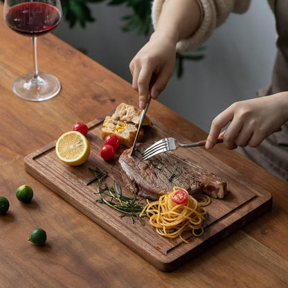 Muso Wood Small Cutting Board with Handle, Walnut Wooden Chopping Boards for Bread, Vegetables & Fruits, Dinner Cheese Board with Hole(15.2x7.3 Inches)