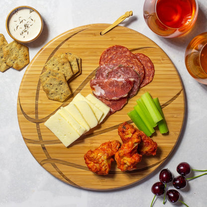 Football Shaped Bamboo Wood Cutting Board and Charcuterie Board, Great Gift for Football Fans | Football serving board for game day watch parties and tailgating. Smooth reverse side for prep. Hangs as decor between uses.