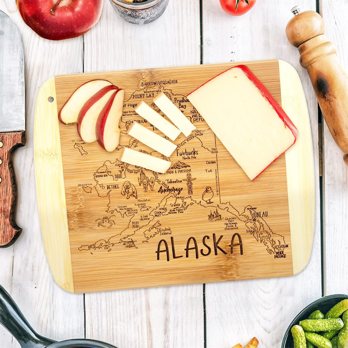 A Slice of Life New Jersey Engraved Map Cutting Board | 11” x 8.75” charcuterie board with engraved state map artwork. Smooth reverse side for food prep. Hang tie for wall display. - Colors B