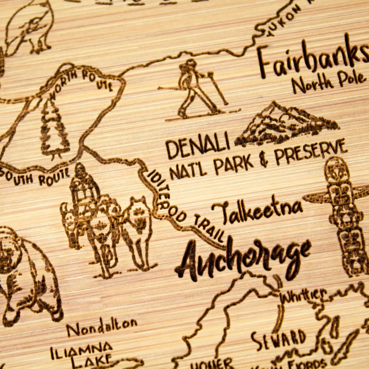 A Slice of Life New Jersey Engraved Map Cutting Board | 11” x 8.75” charcuterie board with engraved state map artwork. Smooth reverse side for food prep. Hang tie for wall display. - Colors B