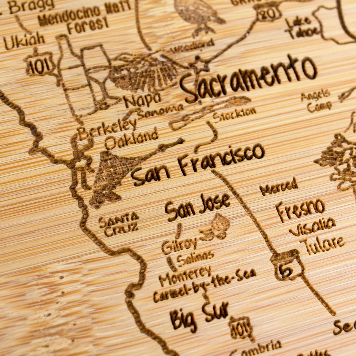 A Slice of Life New Jersey Engraved Map Cutting Board | 11” x 8.75” charcuterie board with engraved state map artwork. Smooth reverse side for food prep. Hang tie for wall display. - Colors B
