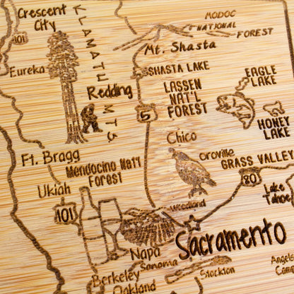 A Slice of Life New Jersey Engraved Map Cutting Board | 11” x 8.75” charcuterie board with engraved state map artwork. Smooth reverse side for food prep. Hang tie for wall display. - Colors B