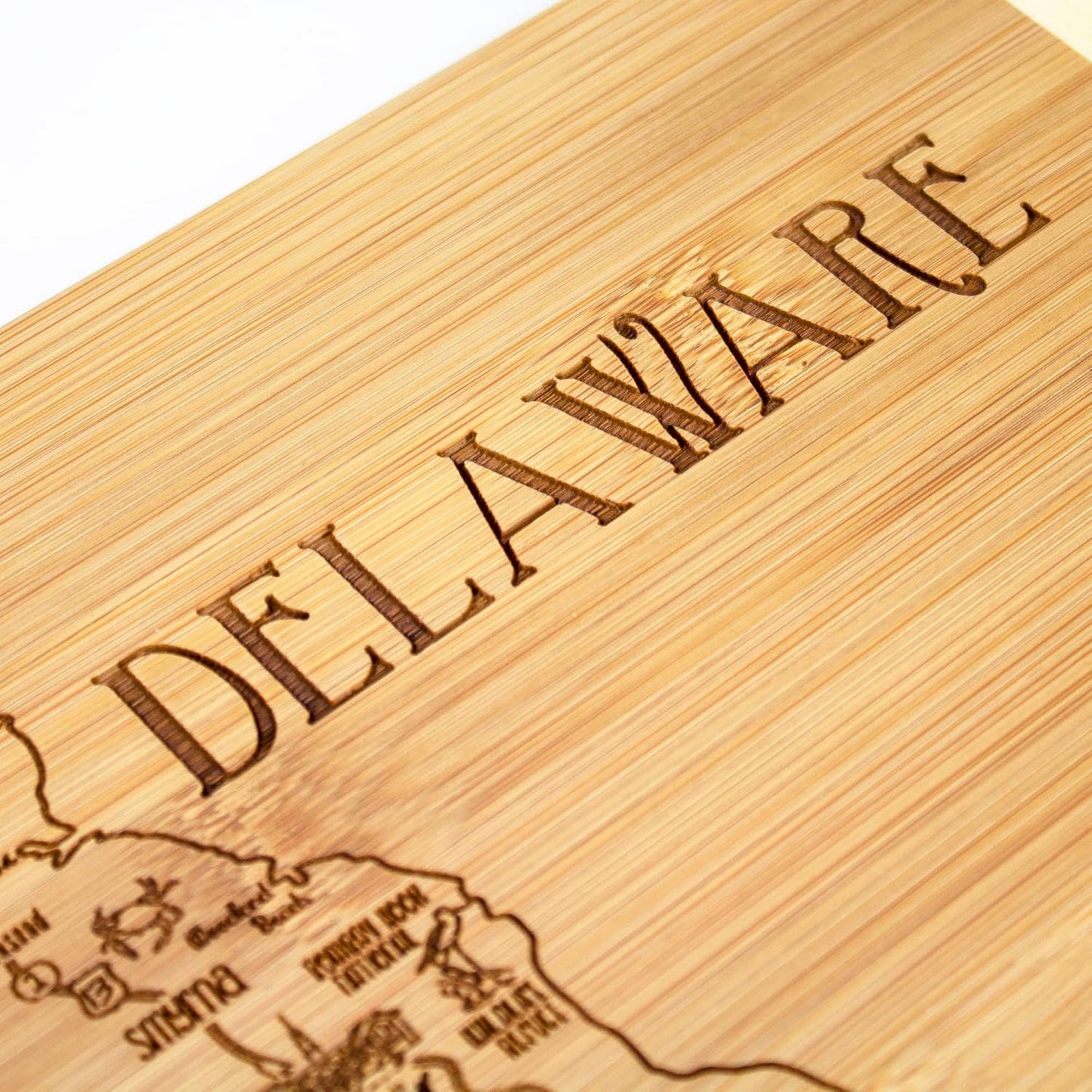 A Slice of Life New Jersey Engraved Map Cutting Board | 11” x 8.75” charcuterie board with engraved state map artwork. Smooth reverse side for food prep. Hang tie for wall display. - Colors B