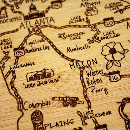 A Slice of Life New Jersey Engraved Map Cutting Board | 11” x 8.75” charcuterie board with engraved state map artwork. Smooth reverse side for food prep. Hang tie for wall display. - Colors B