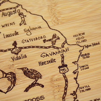 A Slice of Life New Jersey Engraved Map Cutting Board | 11” x 8.75” charcuterie board with engraved state map artwork. Smooth reverse side for food prep. Hang tie for wall display. - Colors B