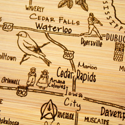 A Slice of Life New Jersey Engraved Map Cutting Board | 11” x 8.75” charcuterie board with engraved state map artwork. Smooth reverse side for food prep. Hang tie for wall display. - Colors B