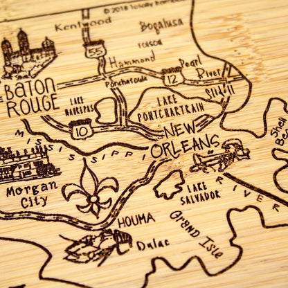 A Slice of Life New Jersey Engraved Map Cutting Board | 11” x 8.75” charcuterie board with engraved state map artwork. Smooth reverse side for food prep. Hang tie for wall display. - Colors B
