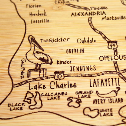 A Slice of Life New Jersey Engraved Map Cutting Board | 11” x 8.75” charcuterie board with engraved state map artwork. Smooth reverse side for food prep. Hang tie for wall display. - Colors B