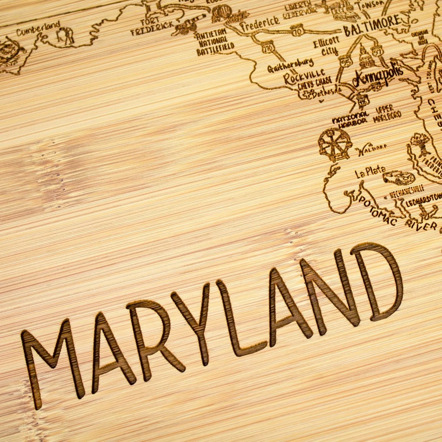 A Slice of Life New Jersey Engraved Map Cutting Board | 11” x 8.75” charcuterie board with engraved state map artwork. Smooth reverse side for food prep. Hang tie for wall display. - Colors B