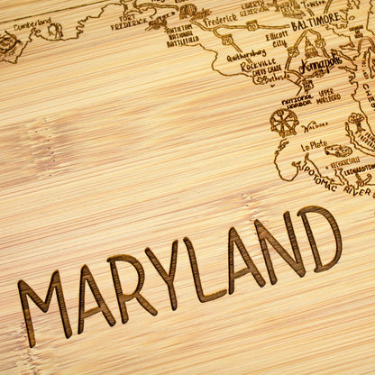 A Slice of Life New Jersey Engraved Map Cutting Board | 11” x 8.75” charcuterie board with engraved state map artwork. Smooth reverse side for food prep. Hang tie for wall display. - Colors B