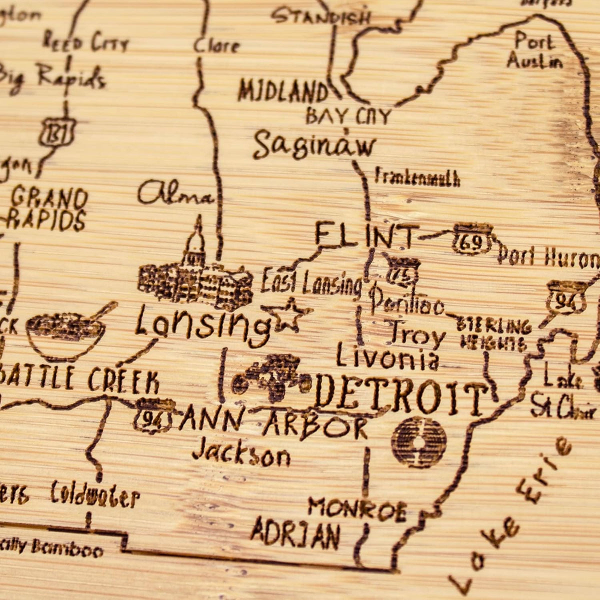 A Slice of Life New Jersey Engraved Map Cutting Board | 11” x 8.75” charcuterie board with engraved state map artwork. Smooth reverse side for food prep. Hang tie for wall display. - Colors B
