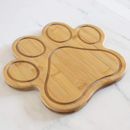 Dog Paw Shaped Cutting and Charcuterie Board, 11 x 10 in | Bamboo paw-shaped serving board with juice grooves for prep and entertaining. Built-in keyhole for easy wall display.