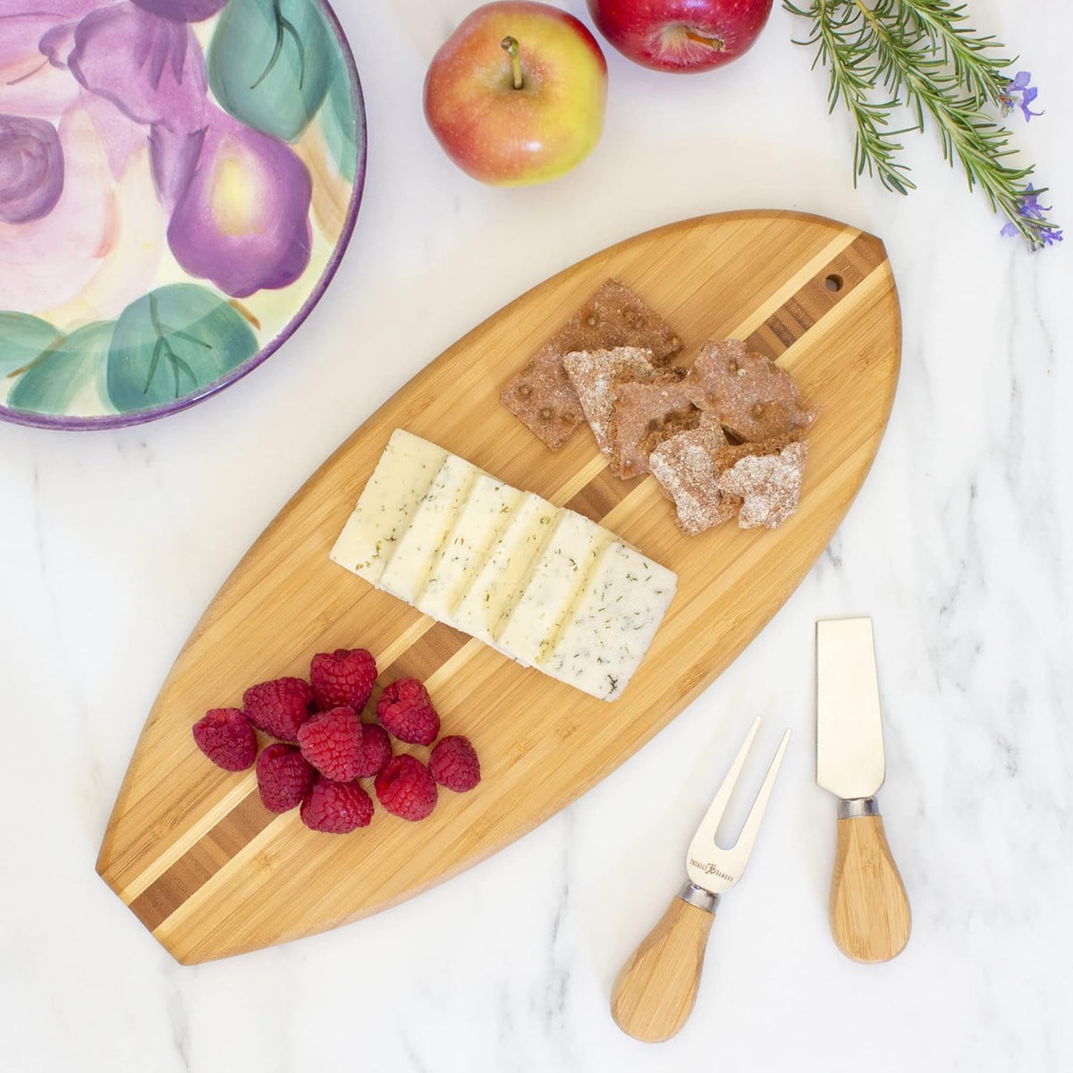 Lil Surfer Small Surfboard Cutting Board, 14.5 x 6 in | Small surfboard-shaped serving board brings beach vibes to charcuterie and snacks. Hang tie for easy wall display.