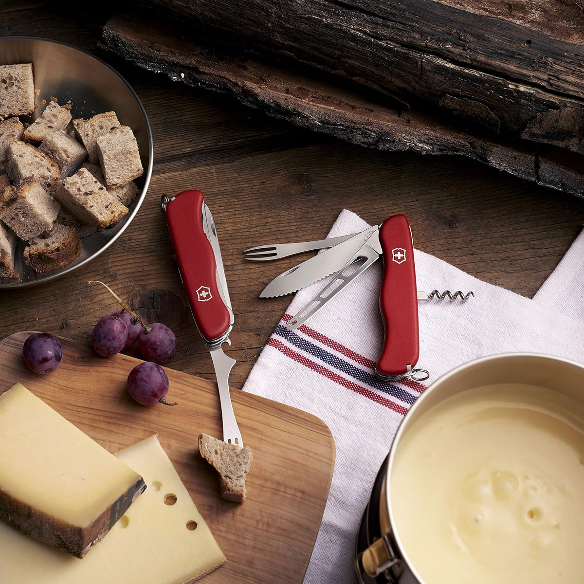 Cheese Master Swiss Made Pocket Knife with Fondue Fork, Red | Compact folding knife features 8 functions including wavy edge lock blade, cheese blade, and integrated fondue fork.