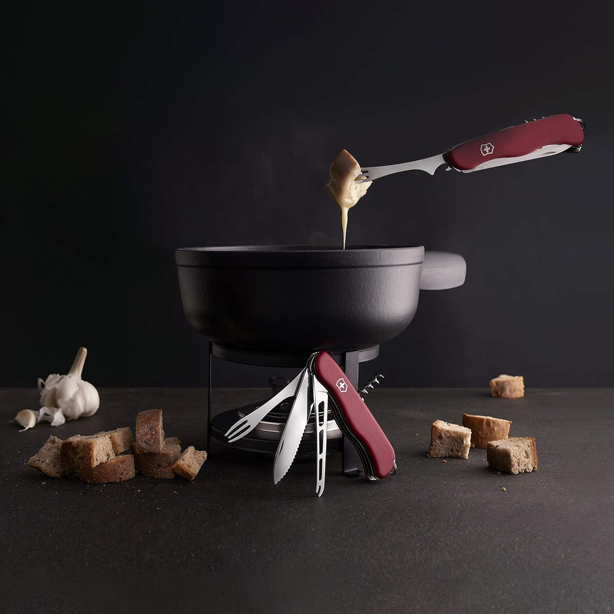 Cheese Master Swiss Made Pocket Knife with Fondue Fork, Red | Compact folding knife features 8 functions including wavy edge lock blade, cheese blade, and integrated fondue fork.