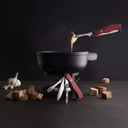 Cheese Master Swiss Made Pocket Knife with Fondue Fork, Red | Compact folding knife features 8 functions including wavy edge lock blade, cheese blade, and integrated fondue fork.