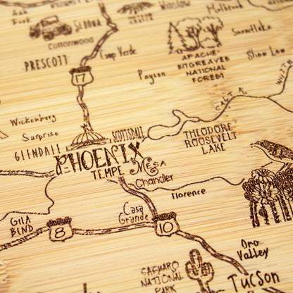 A Slice of Life New Jersey Engraved Map Cutting Board | 11” x 8.75” charcuterie board with engraved state map artwork. Smooth reverse side for food prep. Hang tie for wall display. - Colors A