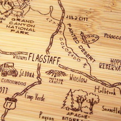 A Slice of Life New Jersey Engraved Map Cutting Board | 11” x 8.75” charcuterie board with engraved state map artwork. Smooth reverse side for food prep. Hang tie for wall display. - Colors A