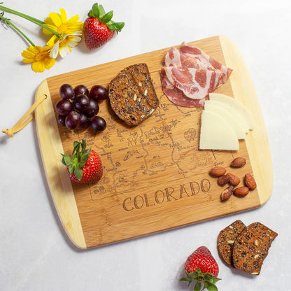 A Slice of Life New Jersey Engraved Map Cutting Board | 11” x 8.75” charcuterie board with engraved state map artwork. Smooth reverse side for food prep. Hang tie for wall display. - Colors A