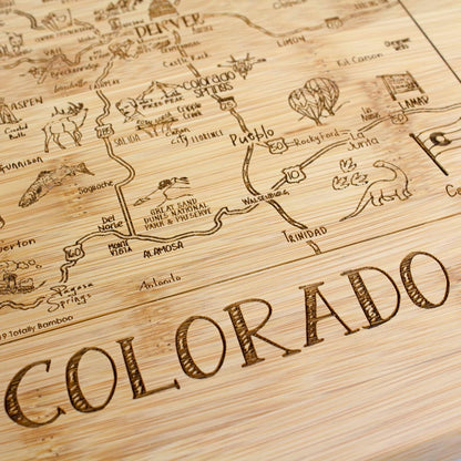 A Slice of Life New Jersey Engraved Map Cutting Board | 11” x 8.75” charcuterie board with engraved state map artwork. Smooth reverse side for food prep. Hang tie for wall display. - Colors A