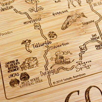 A Slice of Life New Jersey Engraved Map Cutting Board | 11” x 8.75” charcuterie board with engraved state map artwork. Smooth reverse side for food prep. Hang tie for wall display. - Colors A