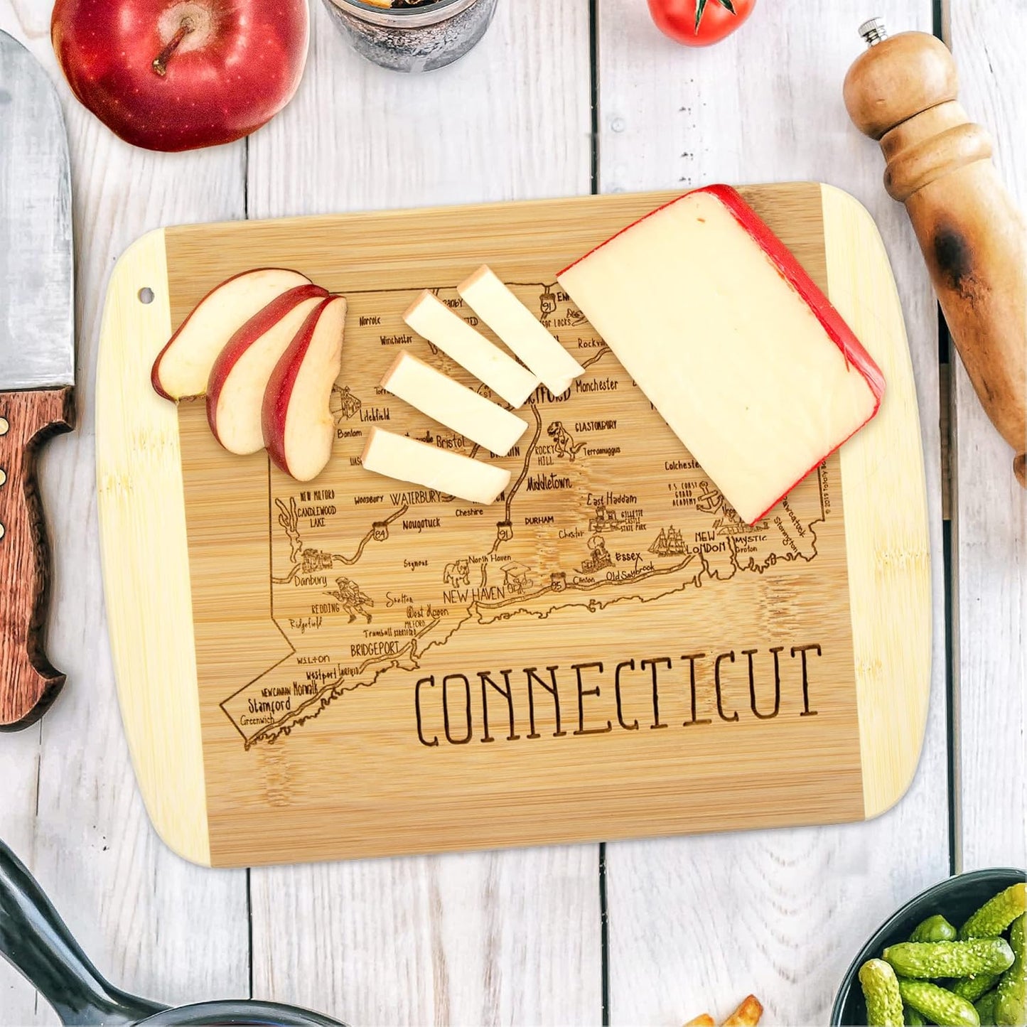 A Slice of Life New Jersey Engraved Map Cutting Board | 11” x 8.75” charcuterie board with engraved state map artwork. Smooth reverse side for food prep. Hang tie for wall display. - Colors A