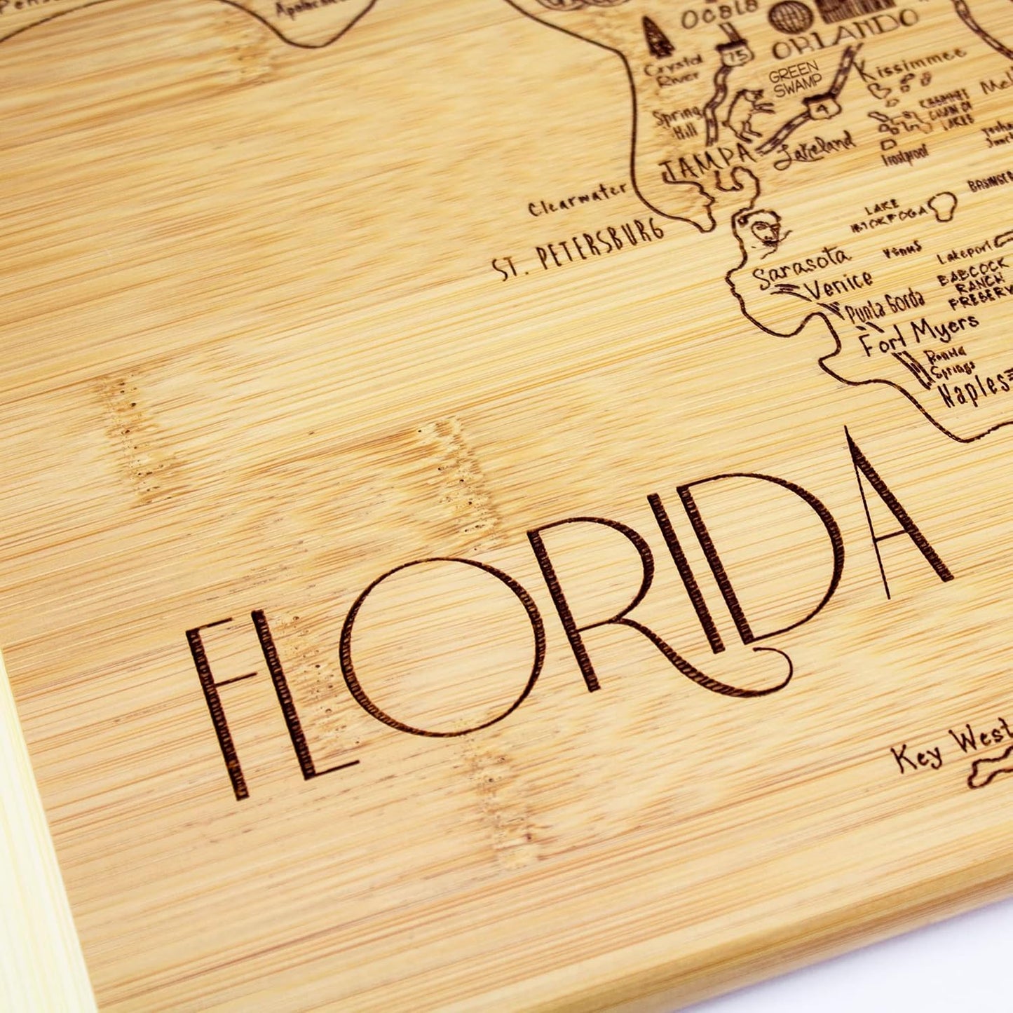 A Slice of Life New Jersey Engraved Map Cutting Board | 11” x 8.75” charcuterie board with engraved state map artwork. Smooth reverse side for food prep. Hang tie for wall display. - Colors A