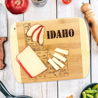 A Slice of Life New Jersey Engraved Map Cutting Board | 11” x 8.75” charcuterie board with engraved state map artwork. Smooth reverse side for food prep. Hang tie for wall display. - Colors A