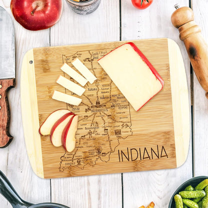 A Slice of Life New Jersey Engraved Map Cutting Board | 11” x 8.75” charcuterie board with engraved state map artwork. Smooth reverse side for food prep. Hang tie for wall display. - Colors A