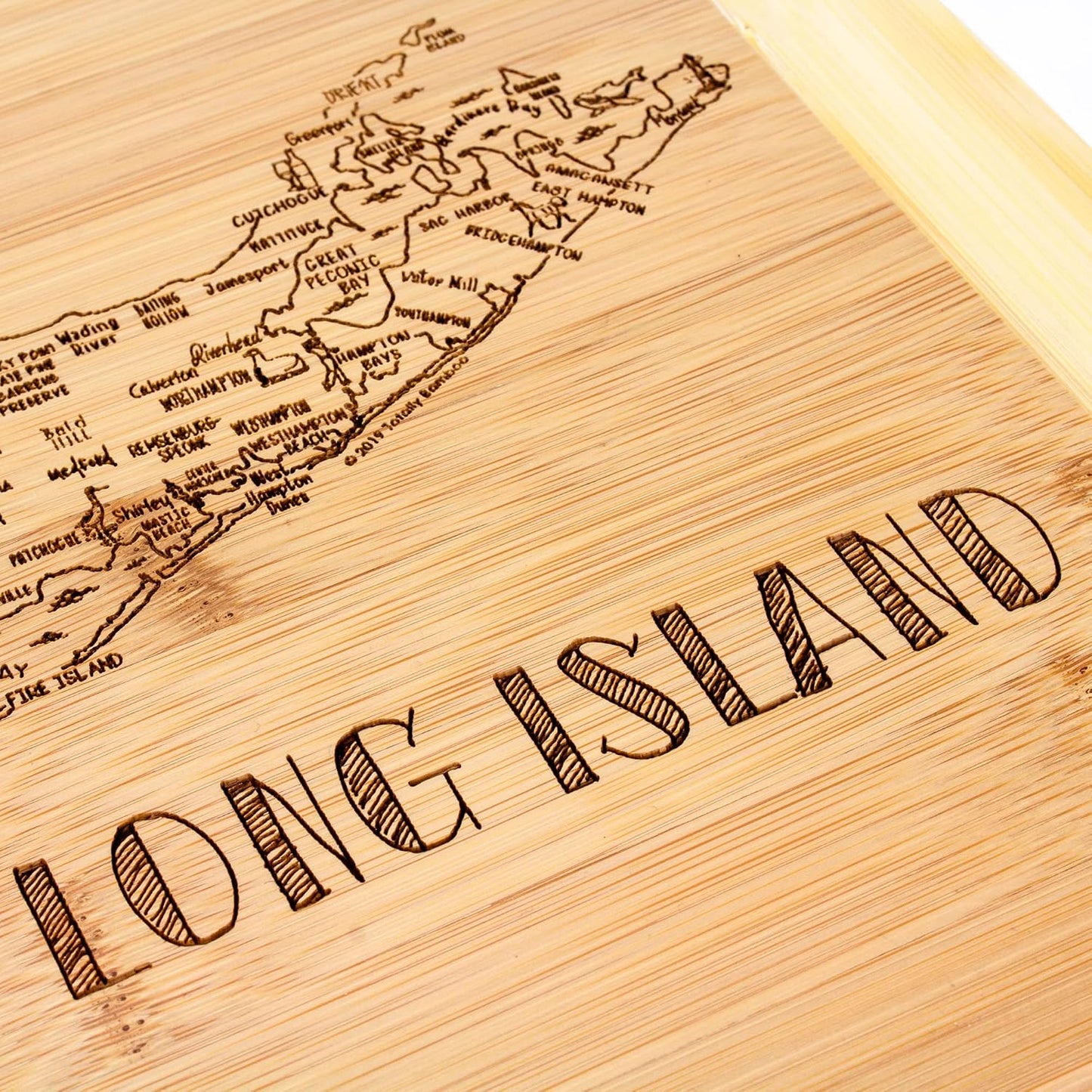 A Slice of Life New Jersey Engraved Map Cutting Board | 11” x 8.75” charcuterie board with engraved state map artwork. Smooth reverse side for food prep. Hang tie for wall display. - Colors A