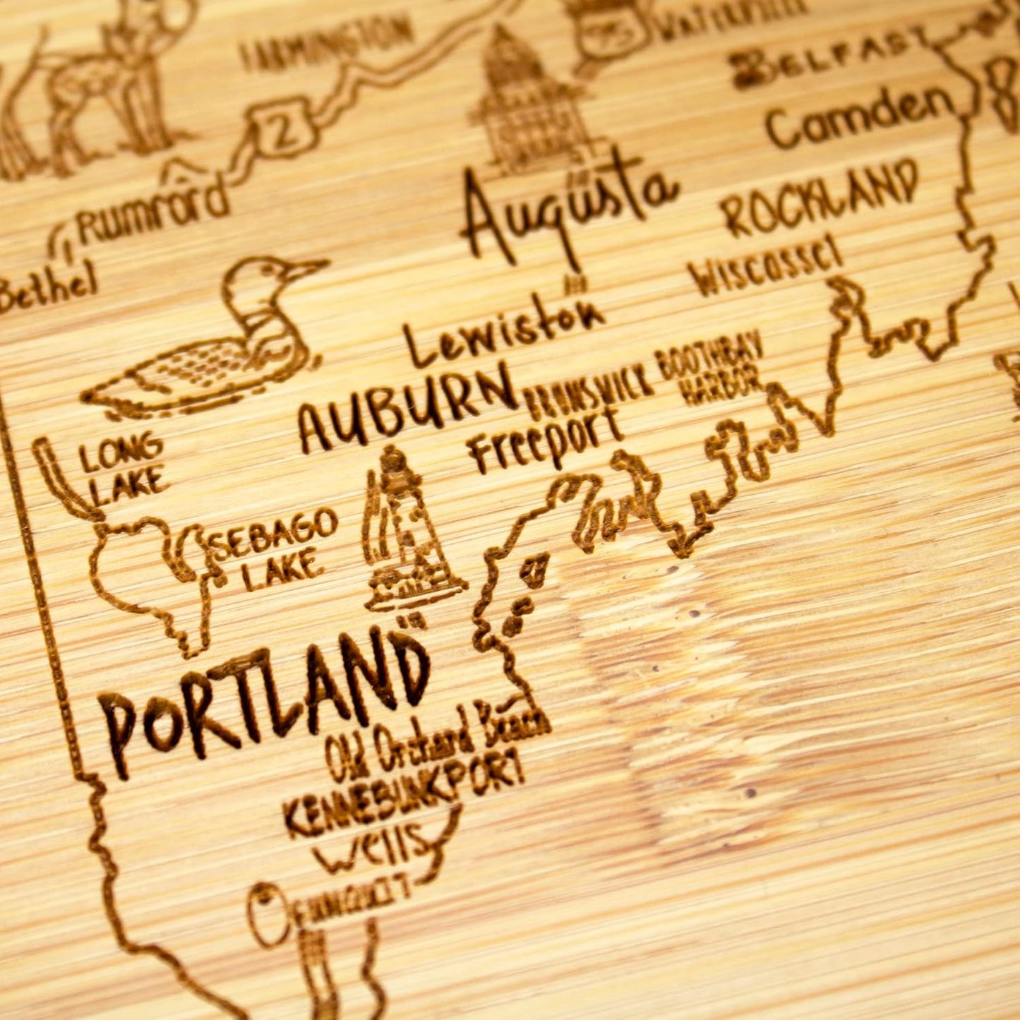 A Slice of Life New Jersey Engraved Map Cutting Board | 11” x 8.75” charcuterie board with engraved state map artwork. Smooth reverse side for food prep. Hang tie for wall display. - Colors A