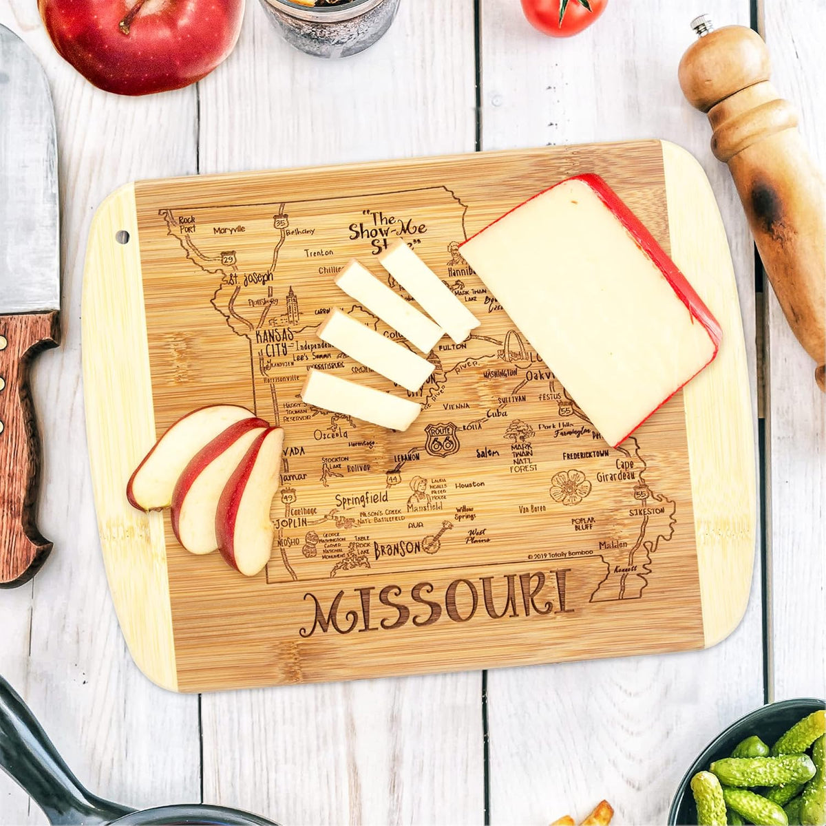 A Slice of Life New Jersey Engraved Map Cutting Board | 11” x 8.75” charcuterie board with engraved state map artwork. Smooth reverse side for food prep. Hang tie for wall display. - Colors A