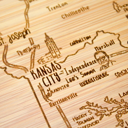 A Slice of Life New Jersey Engraved Map Cutting Board | 11” x 8.75” charcuterie board with engraved state map artwork. Smooth reverse side for food prep. Hang tie for wall display. - Colors A