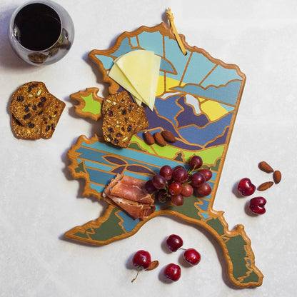 North Carolina State Shaped Cutting Board, Summer Stokes Art | State charcuterie board with colorful hand-drawn landscape art. Smooth reverse side for food prep. Hang tie for wall display. - Colors B
