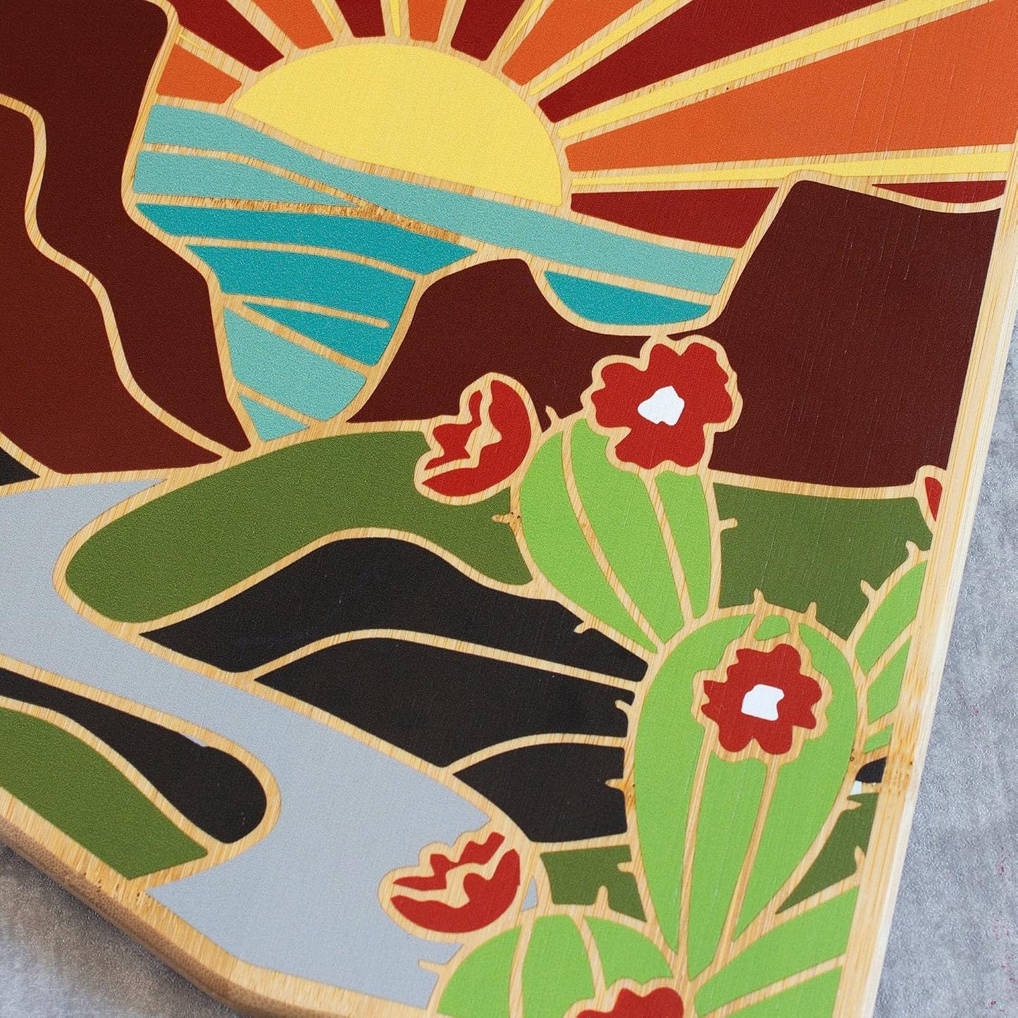 North Carolina State Shaped Cutting Board, Summer Stokes Art | State charcuterie board with colorful hand-drawn landscape art. Smooth reverse side for food prep. Hang tie for wall display. - Colors B