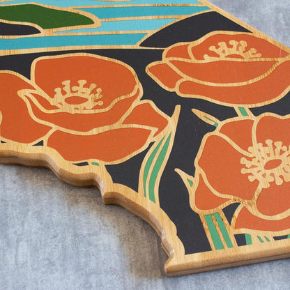 North Carolina State Shaped Cutting Board, Summer Stokes Art | State charcuterie board with colorful hand-drawn landscape art. Smooth reverse side for food prep. Hang tie for wall display. - Colors B